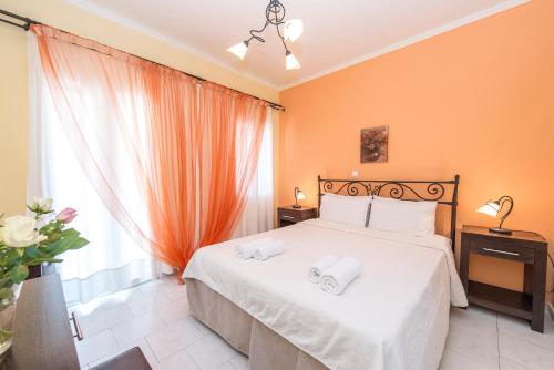 Ένα ή περισσότερα κρεβάτια σε δωμάτιο στο Kostis Villas