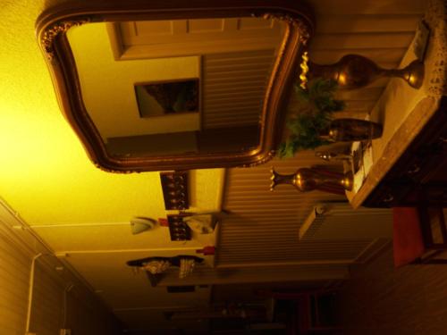 a mirror hanging from the ceiling of a room at Estrela in Manteigas