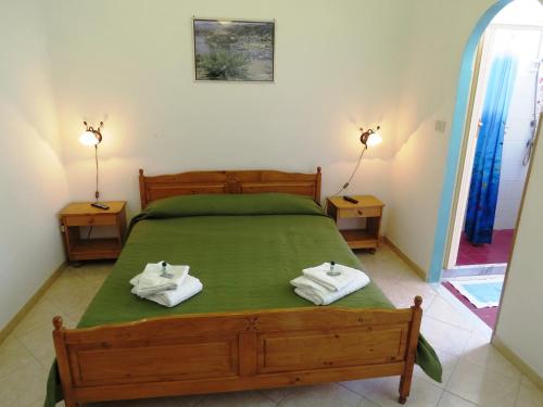 Un pat sau paturi într-o cameră la Casa Vittorio