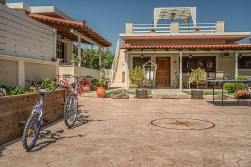 a bike parked in front of a house at Fiorentinos Villa in Tragaki