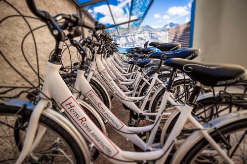 a row of bikes parked next to a building at Hotel Roma Aparthotel in Malcesine