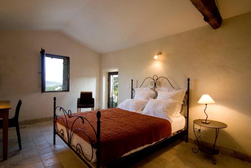 מיטה או מיטות בחדר ב-Hameau de Pichovet
