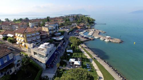 an aerial view of a town next to the water at Hotel Ca' Serena in Sirmione