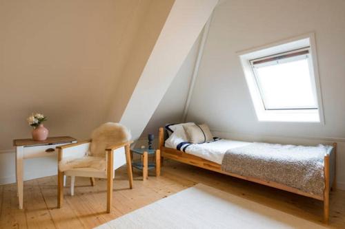Кровать или кровати в номере Vakantie appartement in dorpskern