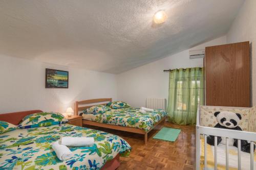 Katil atau katil-katil dalam bilik di Apartmani Žiković