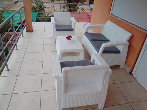 two chairs and a table on a balcony at Apartments Jerković in Stari Grad