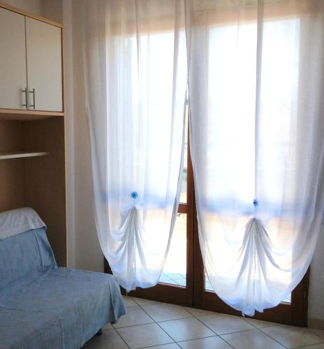 Postel nebo postele na pokoji v ubytování Residence Riva Blu