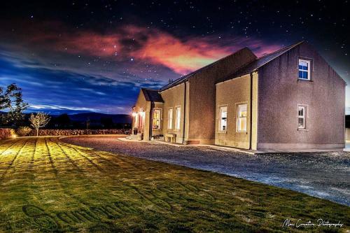 a building at night with a night sky at Samona in Kilkeel