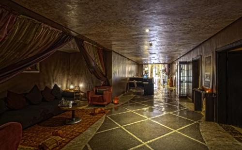 a living room with a couch and a table at Palm Plaza Marrakech in Marrakech