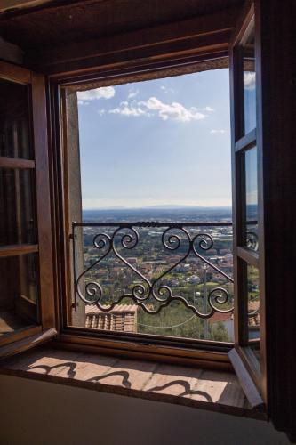 a window with a view of a city at Affittacamere Adri in Uzzano