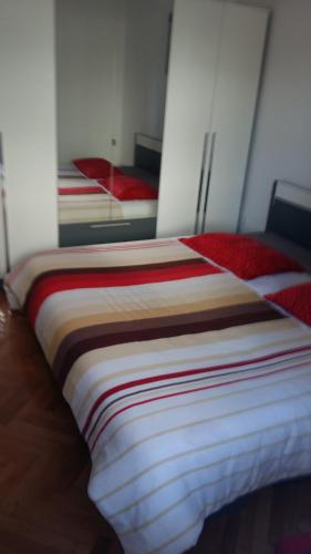 a bed in a room with two identical beds at Apartman Sara in Dugi Rat