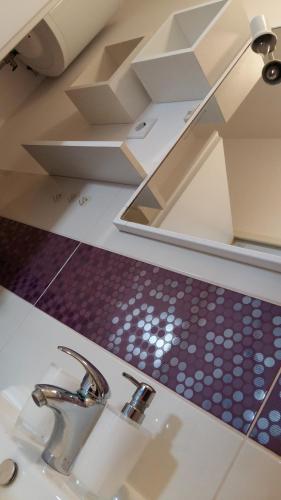 a bathroom counter with a sink and a mirror at Apartman Sara in Dugi Rat