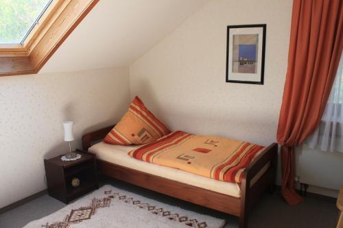 En eller flere senge i et værelse på Ferienwohnung Klosterberg