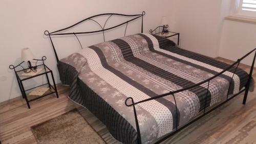 מיטה או מיטות בחדר ב-Rooms Kvestic