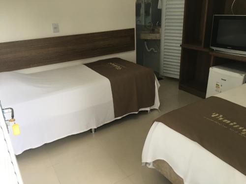 Ένα ή περισσότερα κρεβάτια σε δωμάτιο στο Hotel Vintage