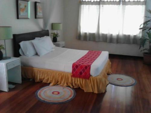 Un pat sau paturi într-o cameră la Casa Joaquin BnB