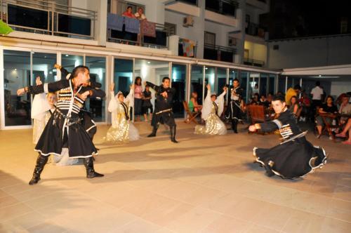 a group of people dancing on a dance floor at Blue Diamond Alya Hotel in Alanya