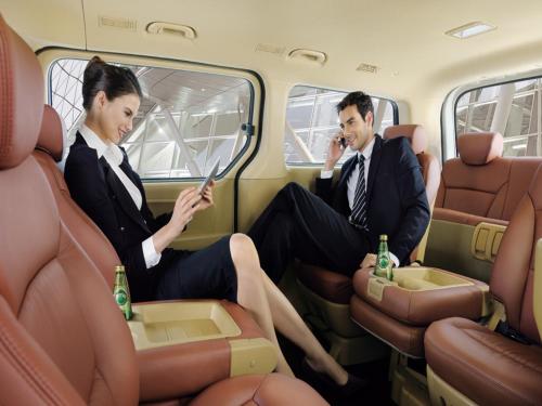 a man and woman sitting in the back of a car at Hallmark Regency Hotel - Johor Bahru in Johor Bahru