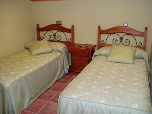 Giường trong phòng chung tại Hospedaje El Marinero