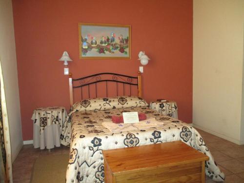Ένα ή περισσότερα κρεβάτια σε δωμάτιο στο Van Rhyn Guest House