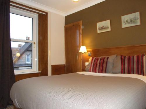 Postel nebo postele na pokoji v ubytování Leith House