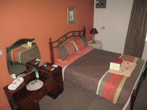 Katil atau katil-katil dalam bilik di Van Rhyn Guest House
