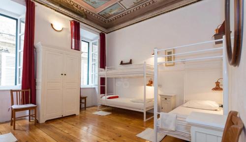 a room with two bunk beds and a ceiling at Old Town Hostel in Dubrovnik