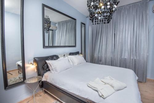 Postel nebo postele na pokoji v ubytování Champagne suites