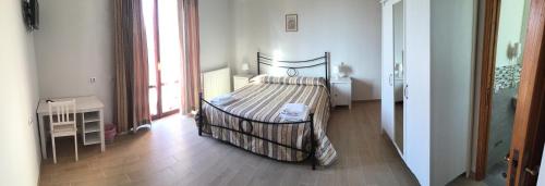 Postel nebo postele na pokoji v ubytování B&B Le Stagioni