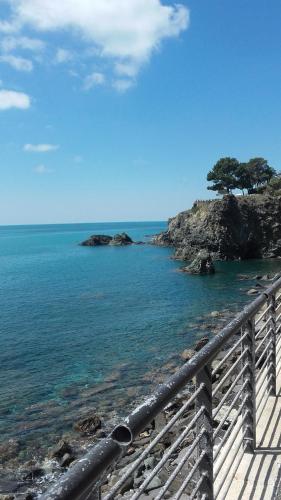 a view of the ocean from a wooden bridge at Stella Marina delle 5 Terre in Levanto