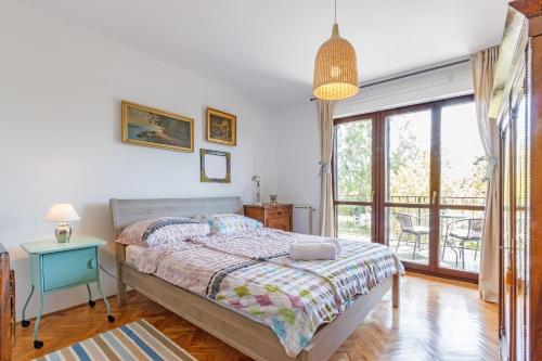Postel nebo postele na pokoji v ubytování Apartments Oskar