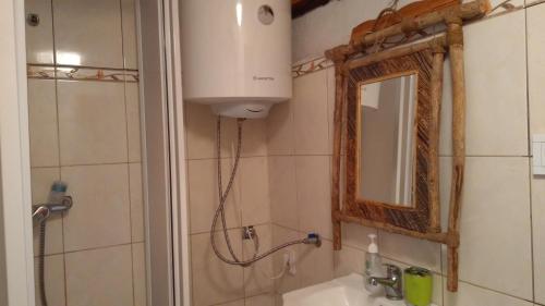 a bathroom with a shower and a sink and a mirror at Chata u sovicky Malino Brdo in Ružomberok