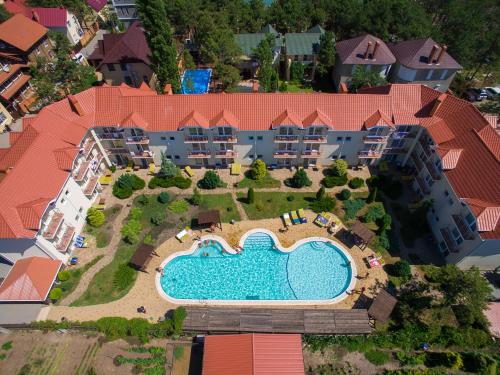 an aerial view of a resort with a swimming pool at Delfin in Koblevo