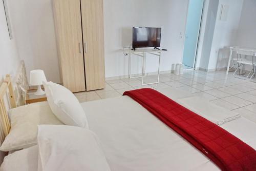 Una cama o camas en una habitación de Ilios