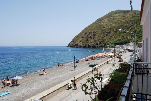 a view of a beach with people on it at Baia Unci in Canneto
