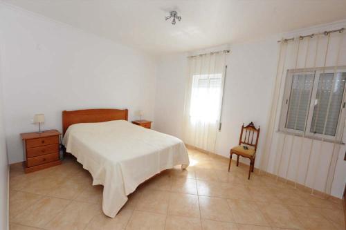 Ένα ή περισσότερα κρεβάτια σε δωμάτιο στο Appartement Quarteira