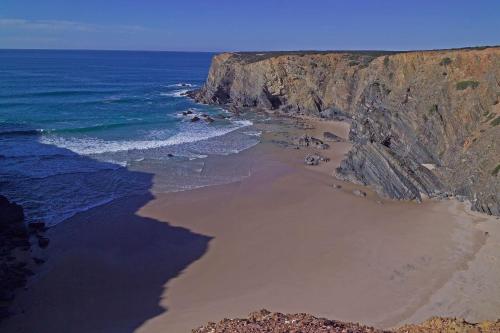 an aerial view of a beach near the ocean at Herdade Do Touril in Zambujeira do Mar