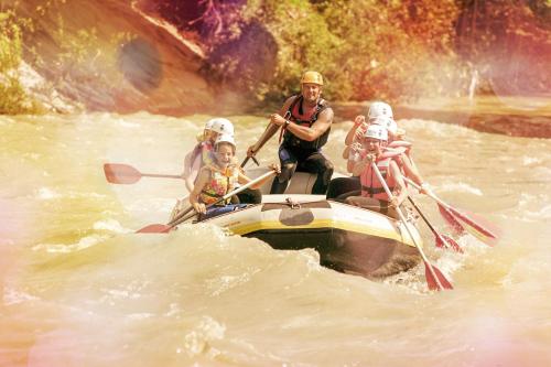a group of people on a boat in the water at Appartement Alpenfex in Flachau