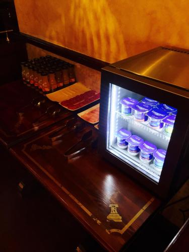 a refrigerator filled with bottles of water on a table at Hostal Juan Carlos in Carboneras