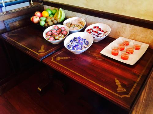 a table with bowls of fruit and other foods on it at Hostal Juan Carlos in Carboneras