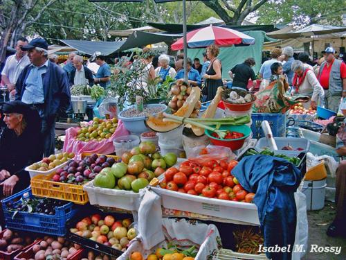 a farmers market with fruits and vegetables on display at Appartement Quarteira in Quarteira