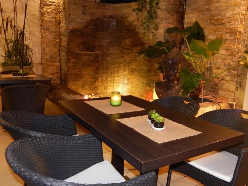 a dining room with a table and chairs at Allamanda Hotel in Port-au-Prince