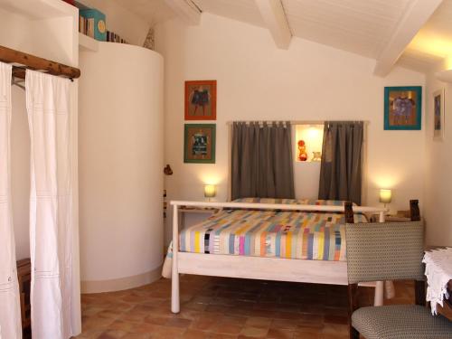 Giường trong phòng chung tại Il Sasso e la Seta