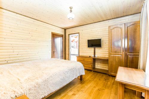 Кровать или кровати в номере Cottage Berdo