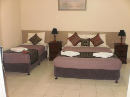Ένα ή περισσότερα κρεβάτια σε δωμάτιο στο Molika Springs Motel