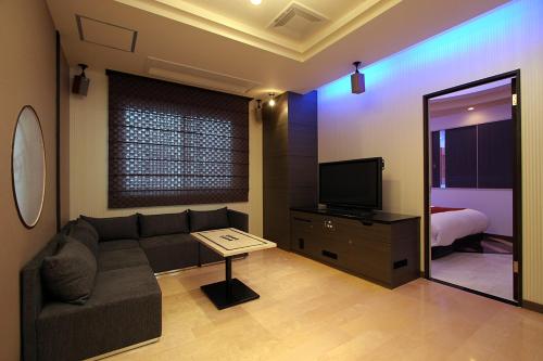 TV a/nebo společenská místnost v ubytování AtoZ Balsresort (Adult Only)