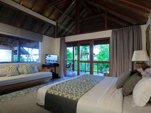 Ein Bett oder Betten in einem Zimmer der Unterkunft Jeeva Santai Villas