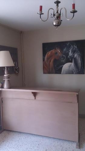a painting of two horses on a wall at Chambres d'hotes du Port Gautier in Vouvray-sur-Loir