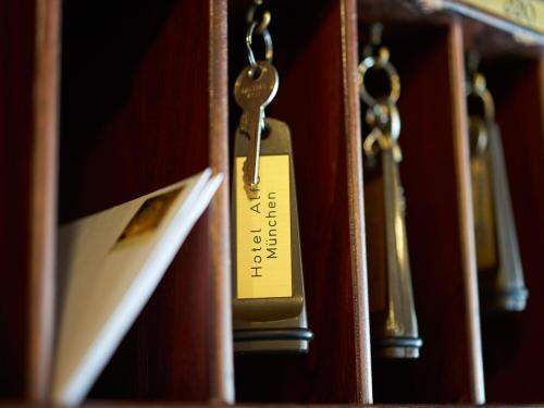 a close up of a door latch with a key at Hotel Alfa Zentrum in Munich