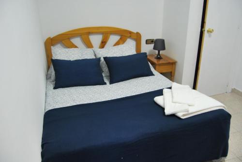 Cama o camas de una habitación en Hostal La Masia